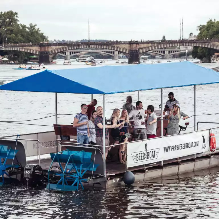 Prague party boat floating on Vltava river.